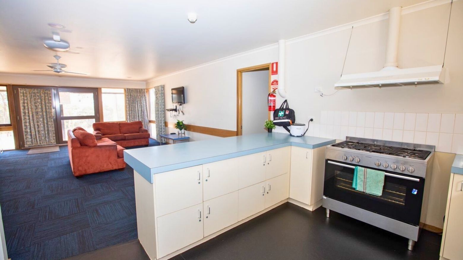 La Trobe University - Terraces shows a kitchen and living area with couch and stove.