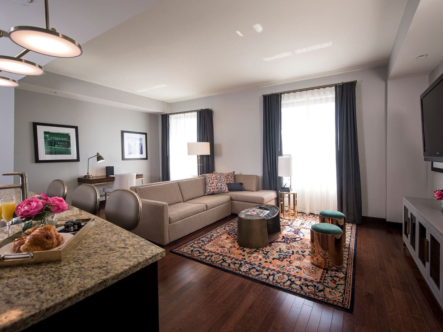 Living area with TV in Mayo Connector Suite at The Mayo Hotel