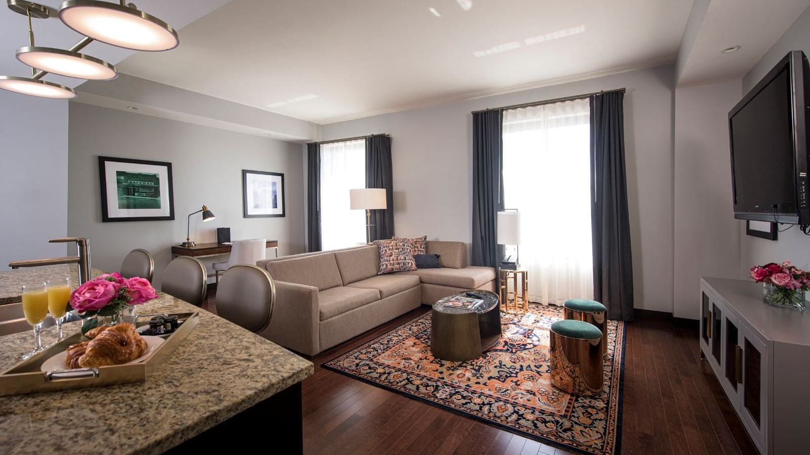 Living area with TV in Mayo Connector Suite at The Mayo Hotel