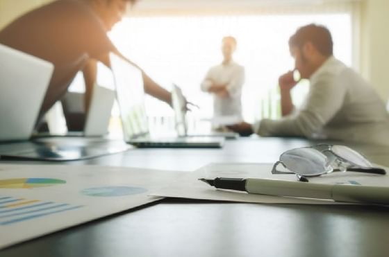 Close-up of Businessmen conducting a meeting at Federal Hotels