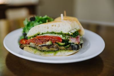 Finely plated sandwich served at Dinah's Garden Hotel