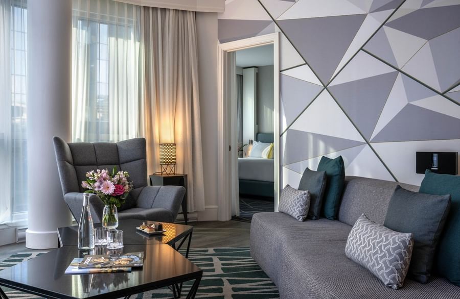 Elegant Crystal Suite living area with plush sofa & contemporary decor at Warwick Le Crystal Montreal