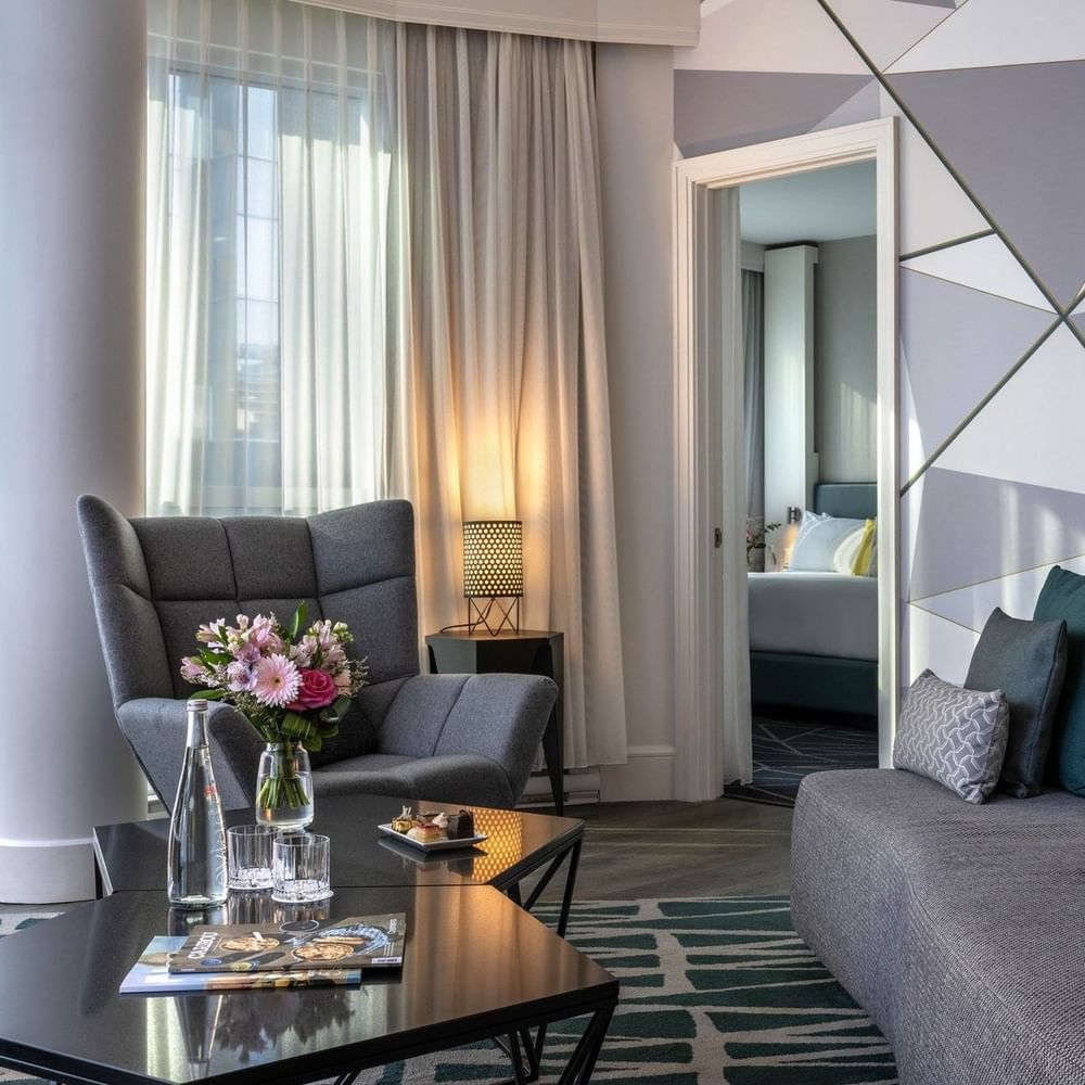 Elegant Crystal Suite living area with plush sofa & contemporary decor at Warwick Le Crystal Montreal
