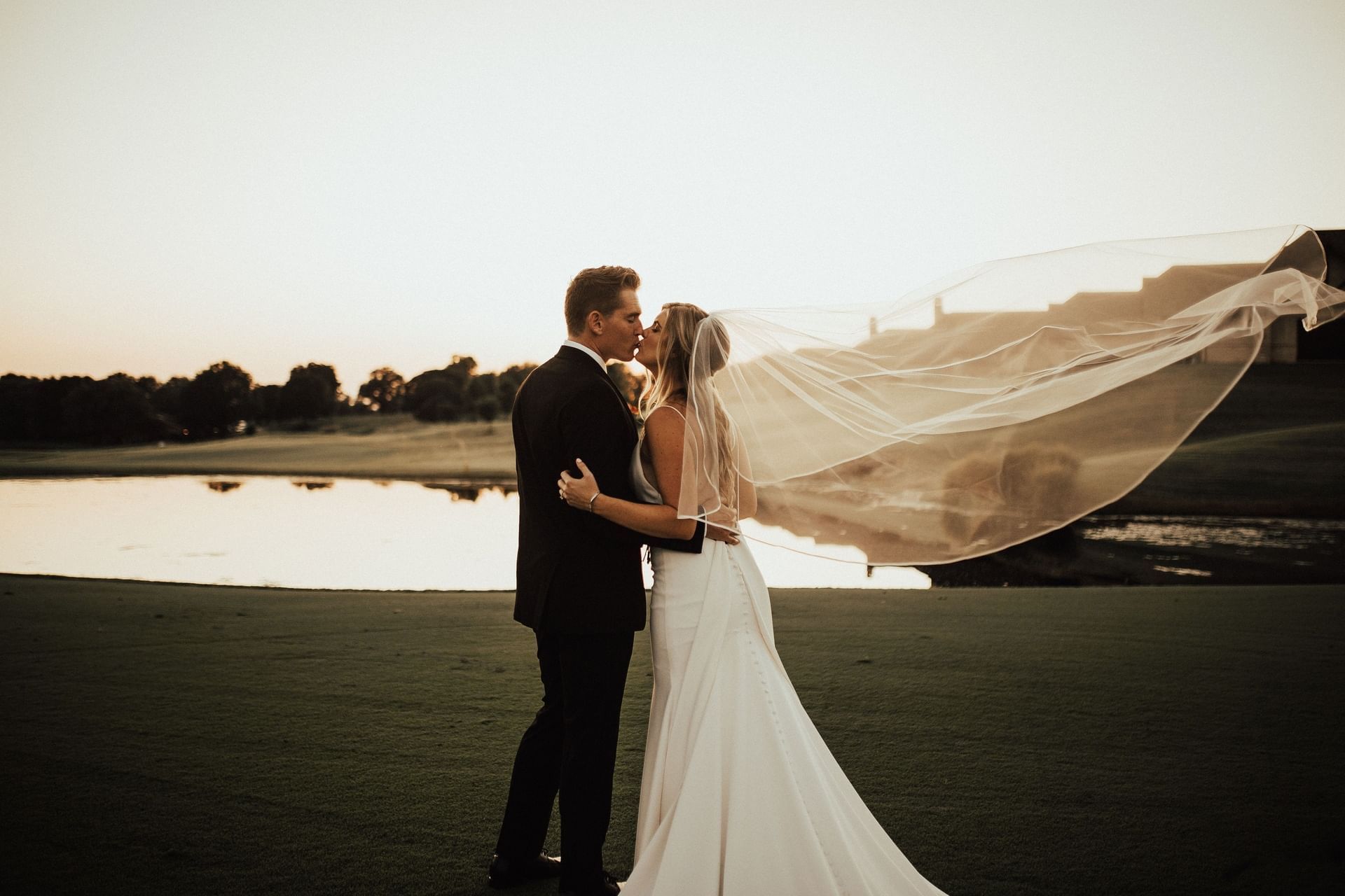 Bride & Groom posing in the golf course at Shangri-La Monkey Island