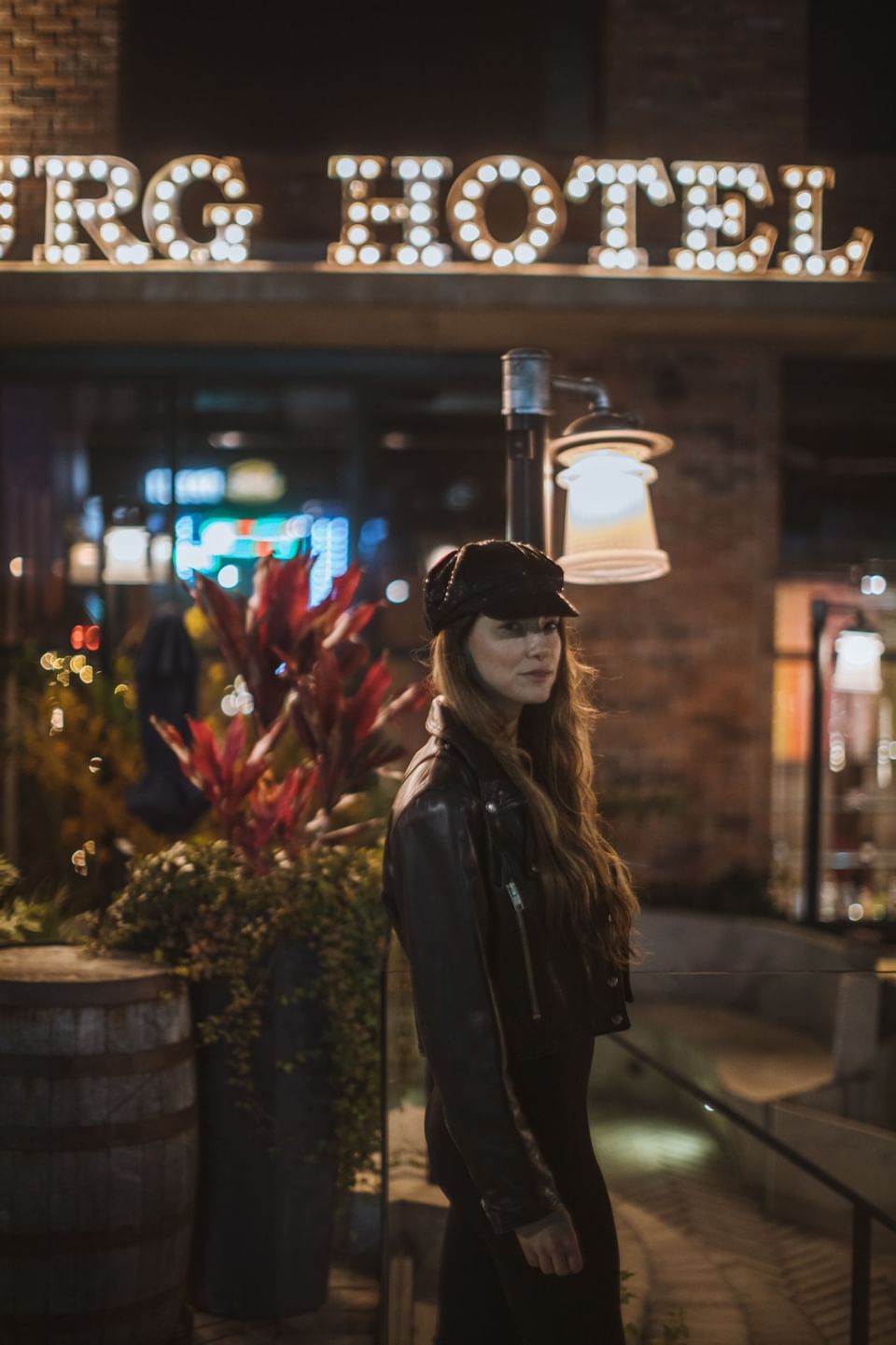 A girl in black jacket standing in the lobby area of Williamsburg Hotel