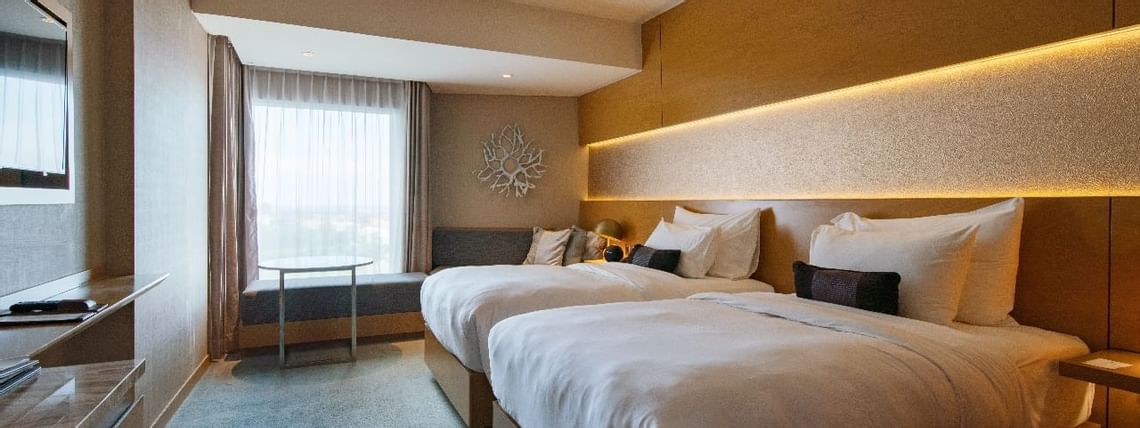 Interior of a room with Double Beds at Vasa Hotel Surabaya
