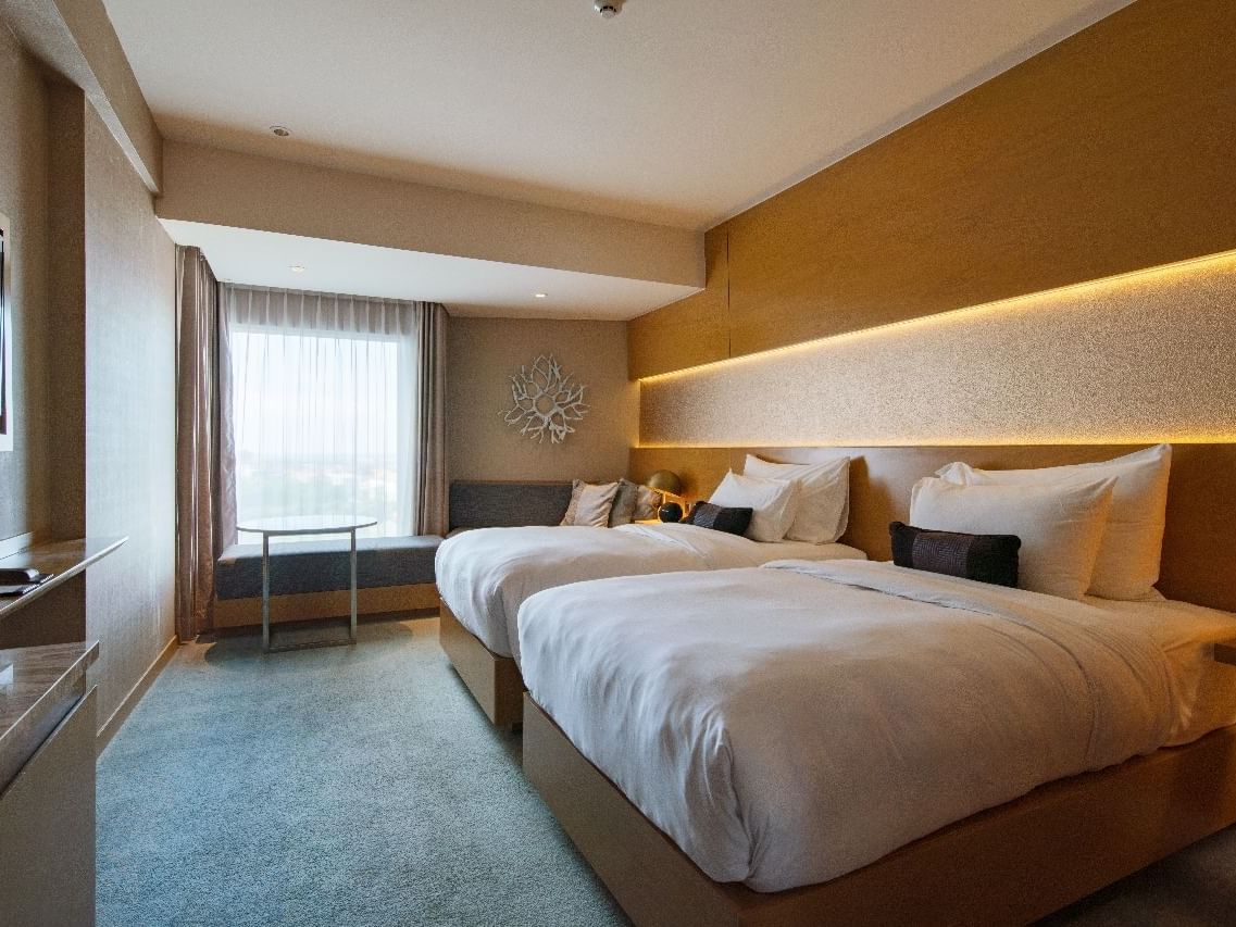 Interior of a room with Double Beds at Vasa Hotel Surabaya