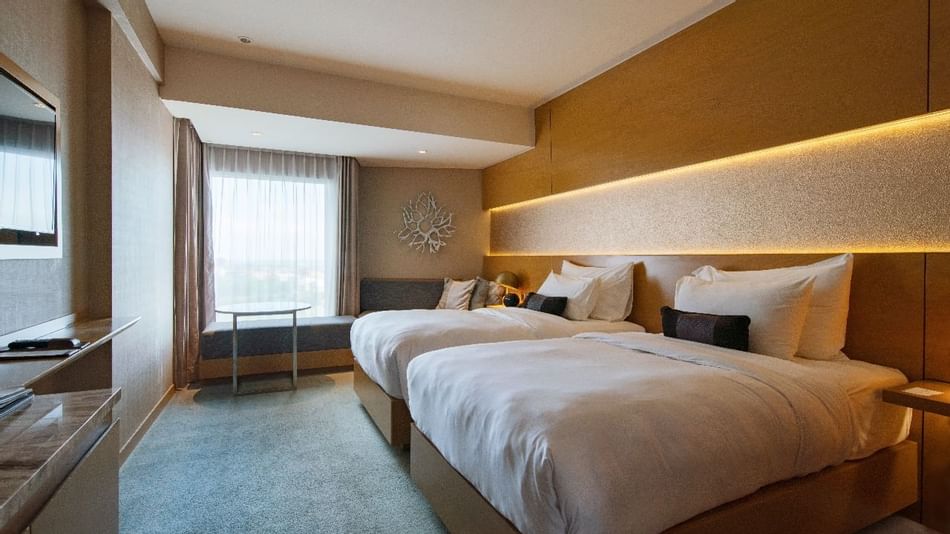 Interior of a room with Double Beds at Vasa Hotel Surabaya