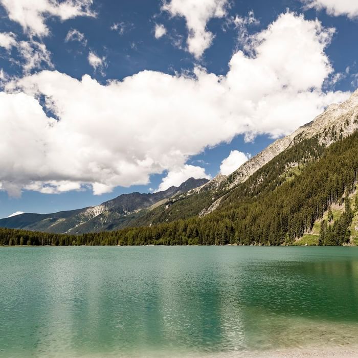 Lake view with snowy mountains near Falkensteiner Hotel Antholz