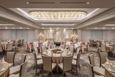 Wedding venue with banquet tables and floral decorations at York Hotel Singapore