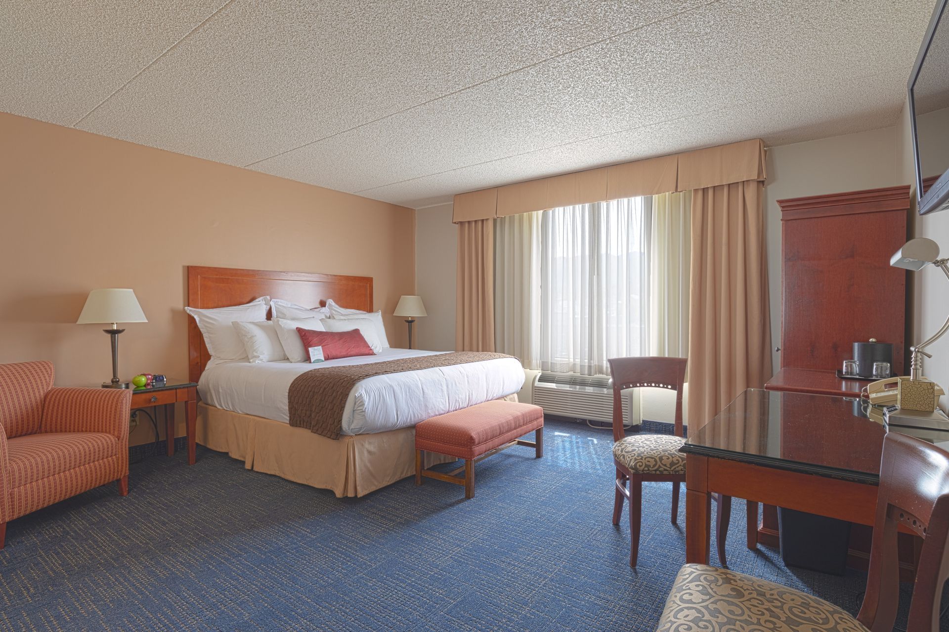 Bed and desk in hotel room