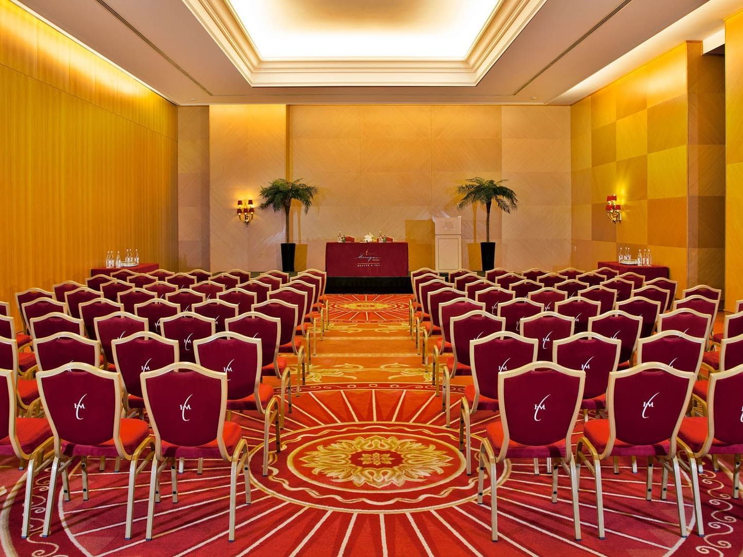 Meeting room arranged with red chairs at Hotel Cascais Miragem