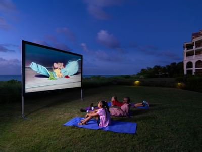 Children watching movie at the garden in Somerset On Grace Bay