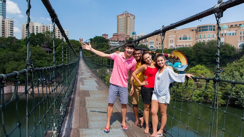 Friends posing on a Suspension Bridge near Sunway Hotel Pyramid