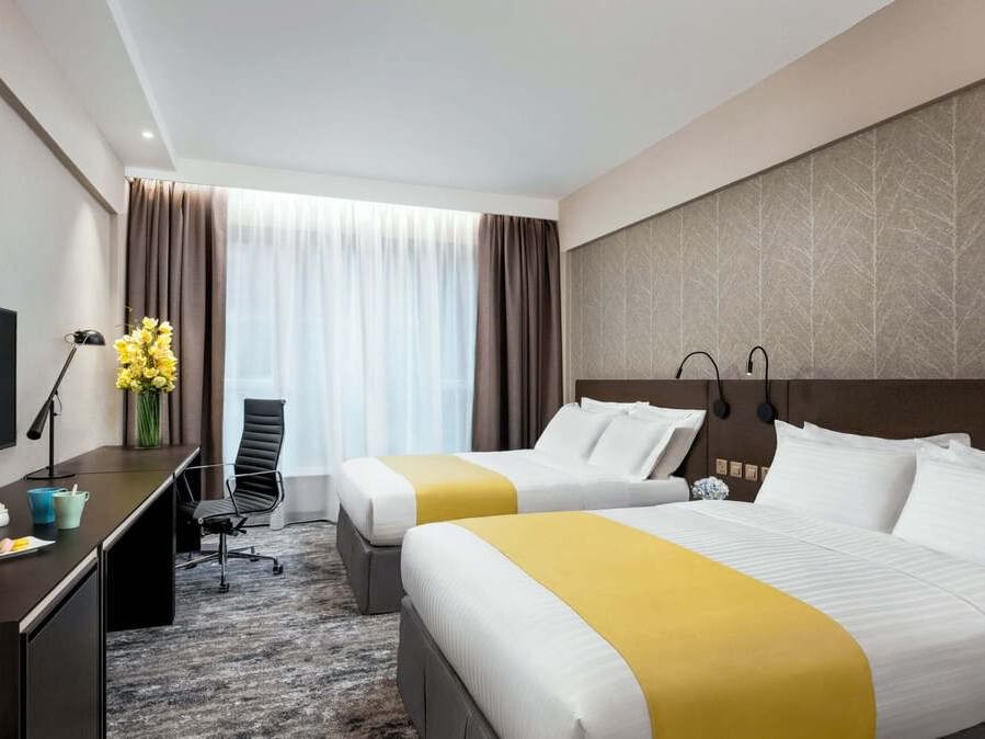 Work desk & TV facing the beds in Deluxe Family Room at Park Hotel Hong Kong