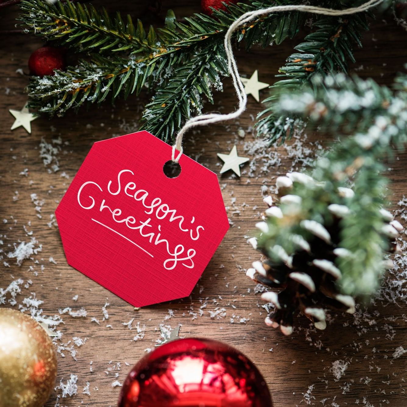 Seasons greeting tag with ornaments at High Peaks Resort