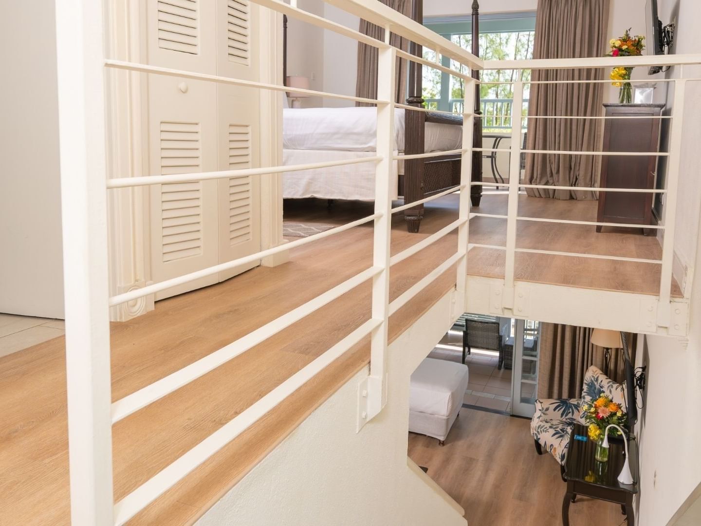 A spacious split-level suite with a balcony at Savannah Beach Hotel.