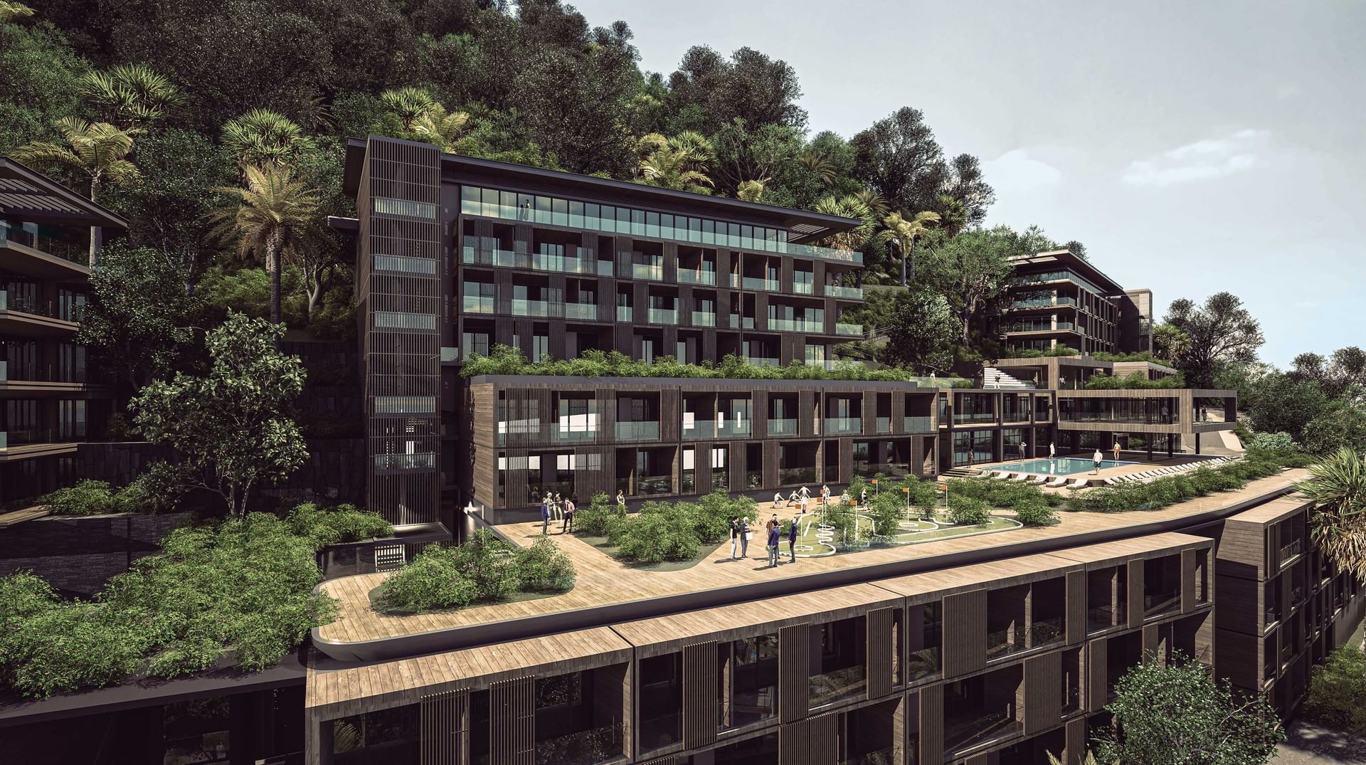 Exterior view of A'ila Residences with large windows, terraces, and a rooftop garden
