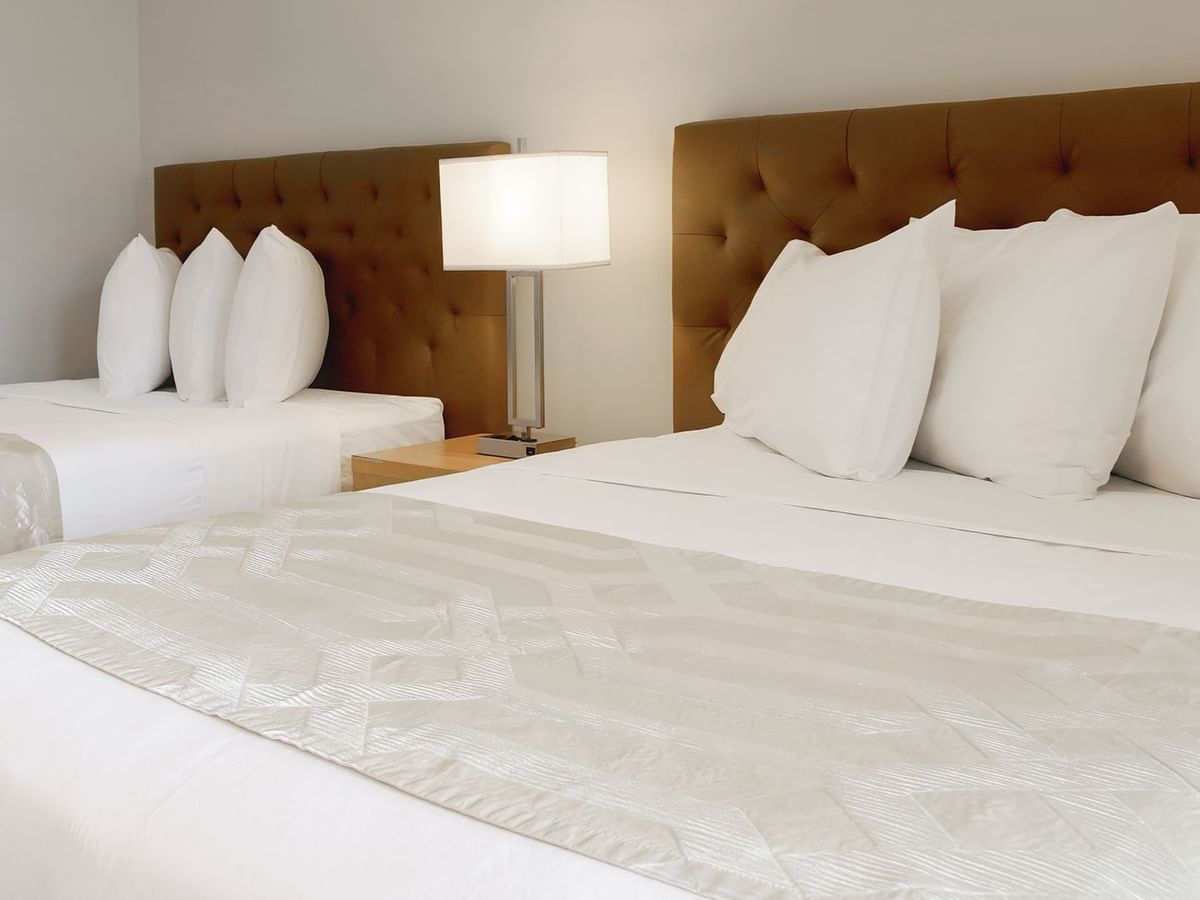 Two double beds neatly arranged