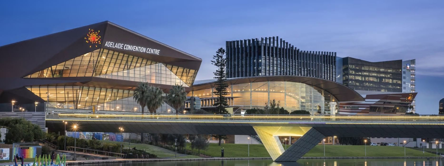 Adelaide Convention Centre, featuring modern architecture & bridge over a river near Ibis Adelaide