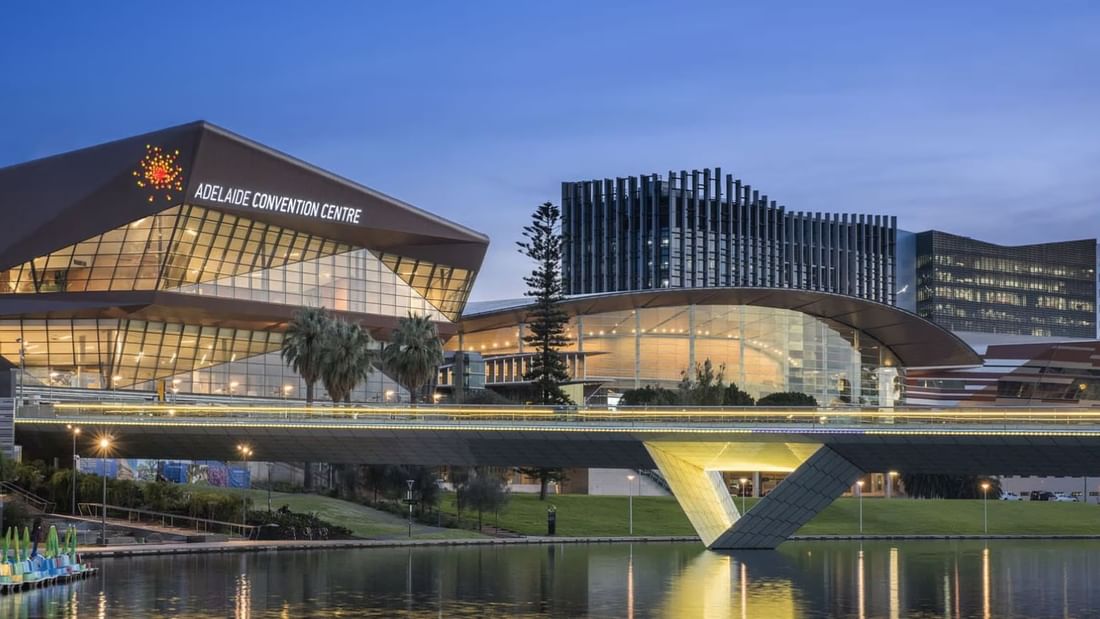 Adelaide Convention Centre, featuring modern architecture & bridge over a river near Ibis Adelaide