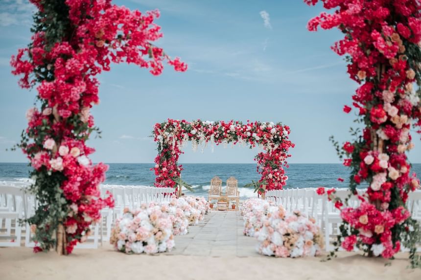 south asian wedding ceremony set up on the beach