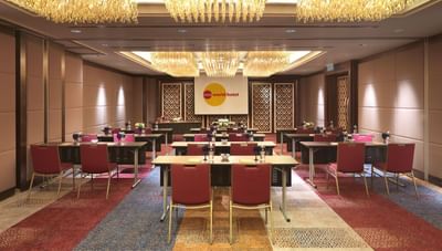 Classroom-style table set up in Hazel Lvy with a warm ambiance at One World Hotel