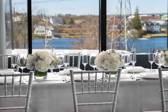 wedding tables next to window overlooking water