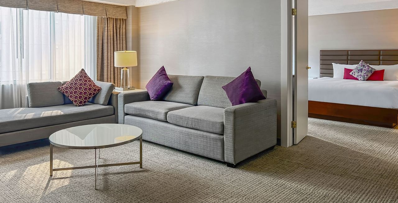 Living area and bedroom of a hotel suite