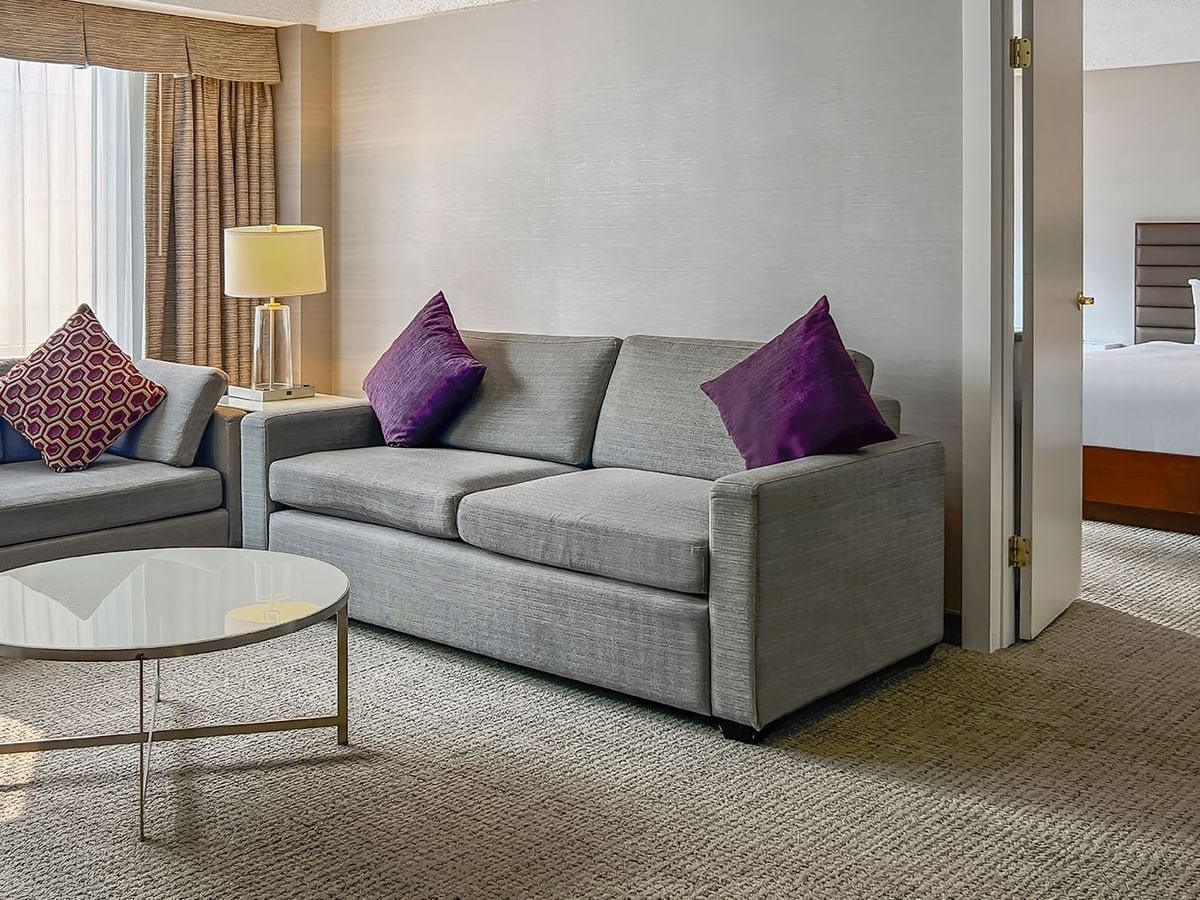 Living area and bedroom of a hotel suite