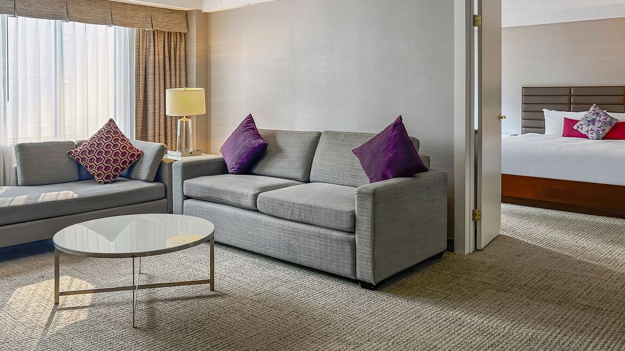 Living area and bedroom of a hotel suite