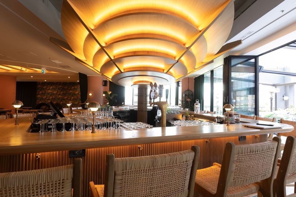 Bar counter area with high stools at Muze Lounge & Terrasse