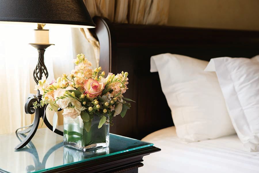 nightstand with bouquet of flowers