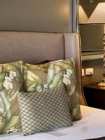 Cozy Erakor Residence bedroom with tropical pillows and elegant decor at Warwick Le Lagon in Efate.