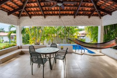 Room terrace with hammock & table at Villas Sol Beach Resort