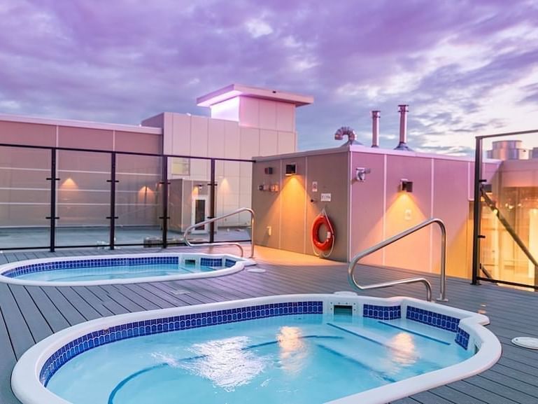 Two rooftop hot tubes at Applause Hotel Calgary