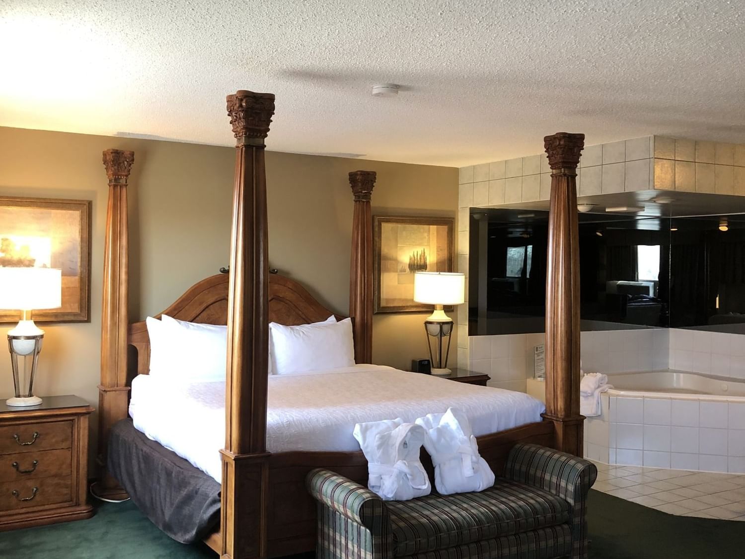 Cozy bed in One King Suite with Jetted Tub at Hotels in Fort McMurray