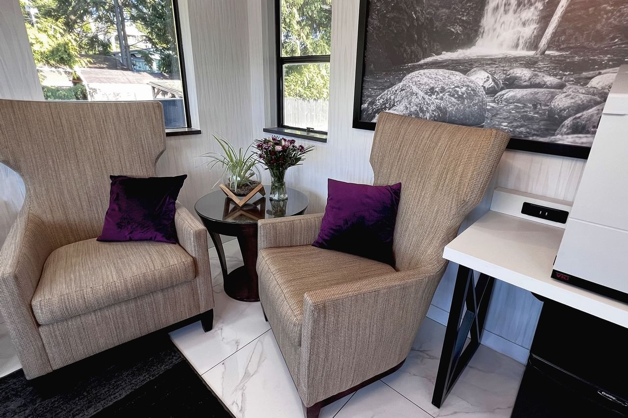 Two chairs with cushions in lobby