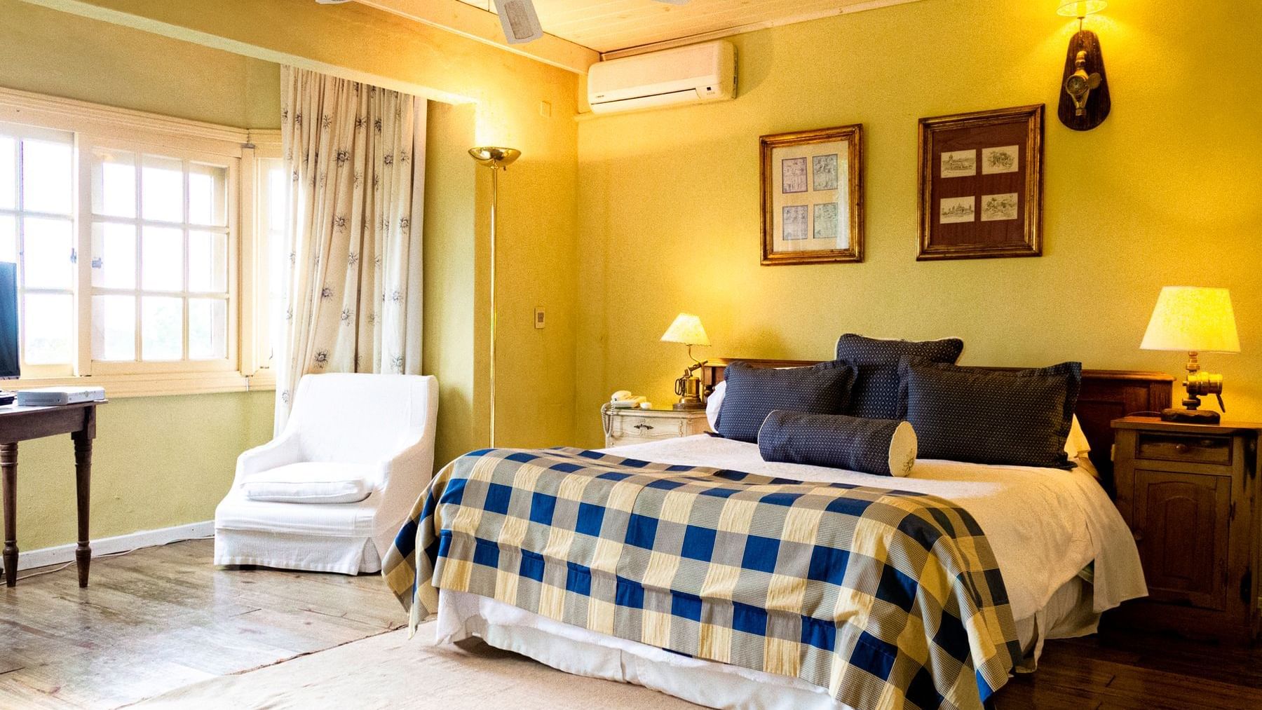 Bedroom arrangement in Standard Bosque suite at DOT Hotels