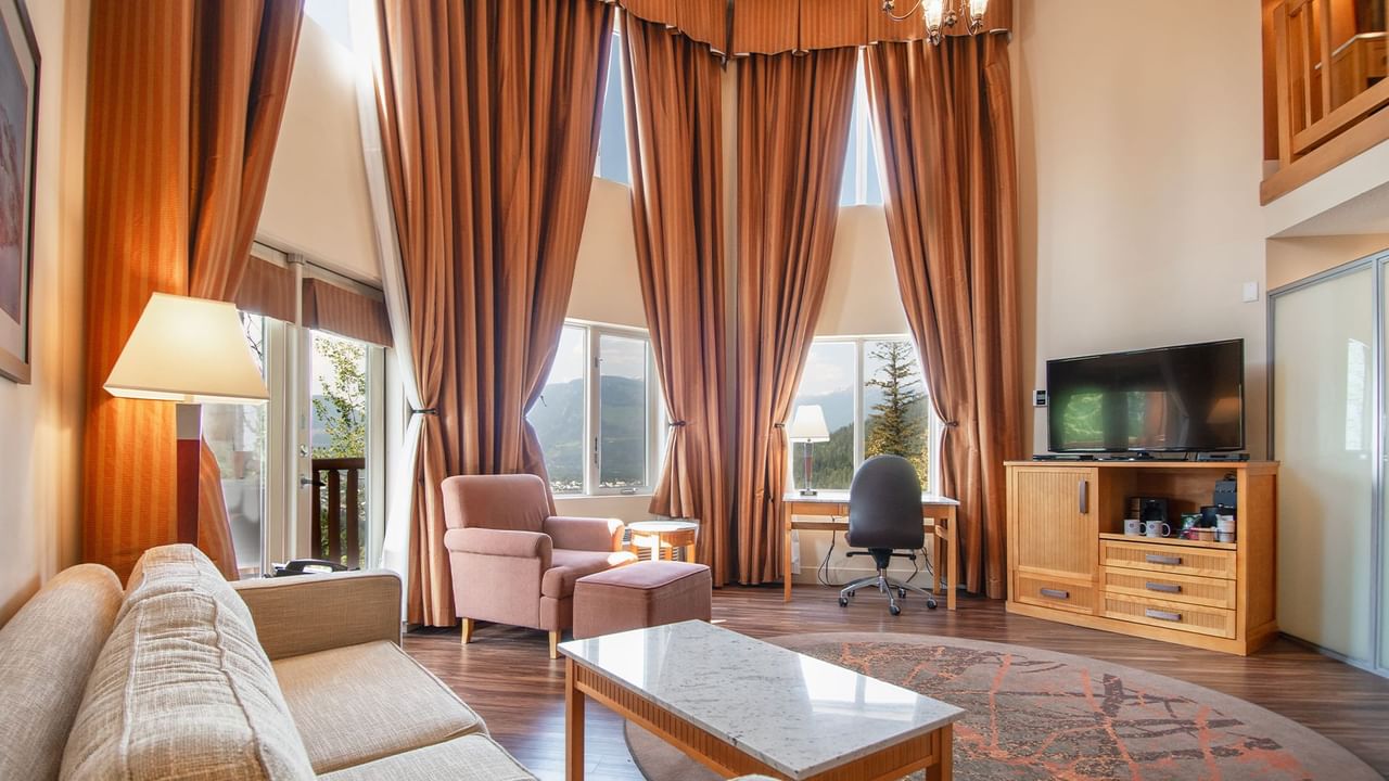 Loft suite with large living area and large windows