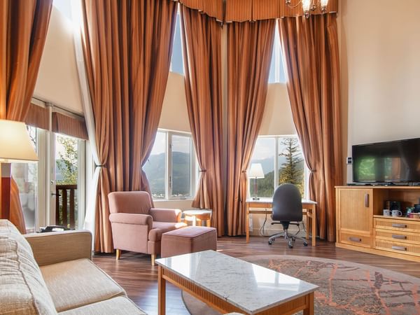 Loft suite with large living area and large windows