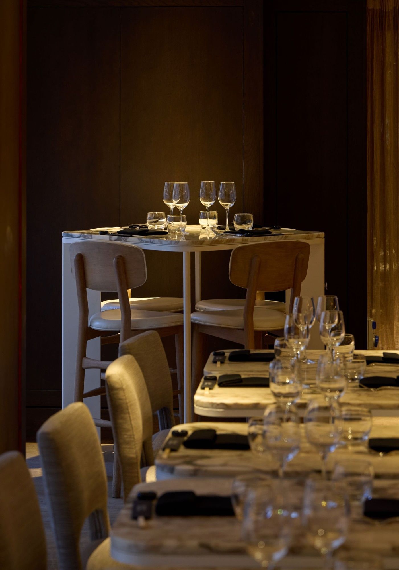 Dinner setup with wine glasses and napkins at May Fair Kitchen