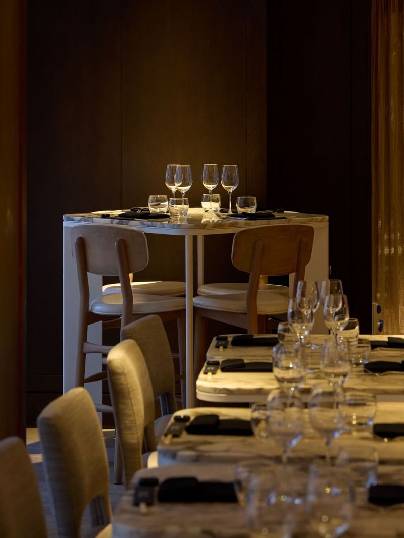 Dinner setup with wine glasses and napkins at May Fair Kitchen