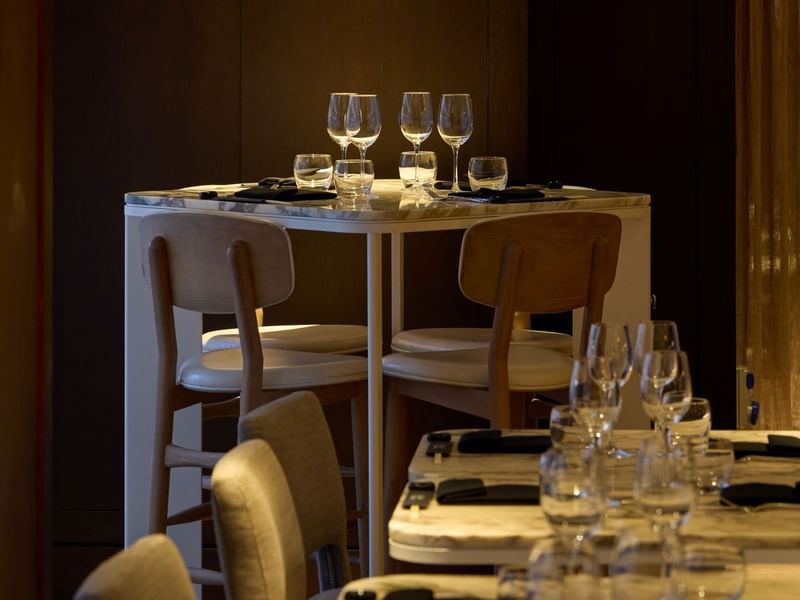 Dinner setup with wine glasses and napkins at May Fair Kitchen