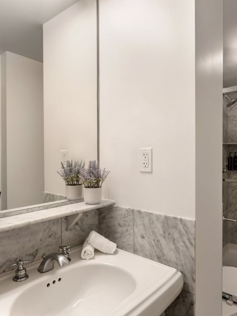 Executive Two Queen Beds bathroom featuring a vanity with a mirror and a glass shower at Warwick Allerton Chicago