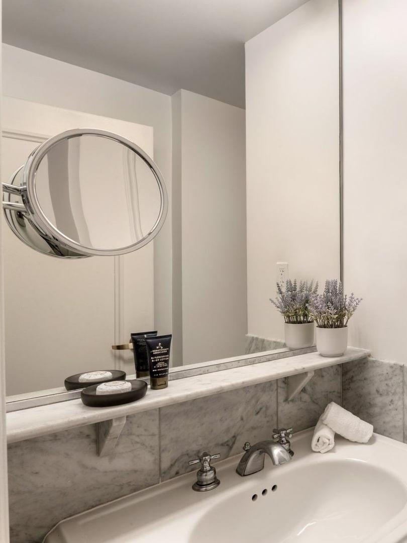 Two Queen Beds bathroom featuring a marble vanity and a glass shower at Warwick Allerton Chicago