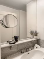 Two Queen Beds bathroom featuring a marble vanity and a glass shower at Warwick Allerton Chicago