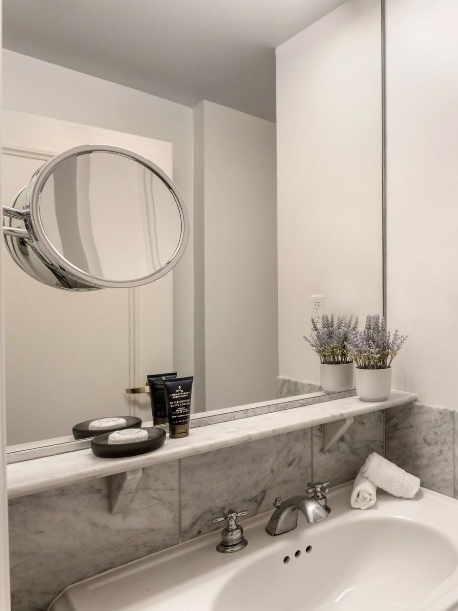 Two Queen Beds bathroom featuring a marble vanity and a glass shower at Warwick Allerton Chicago