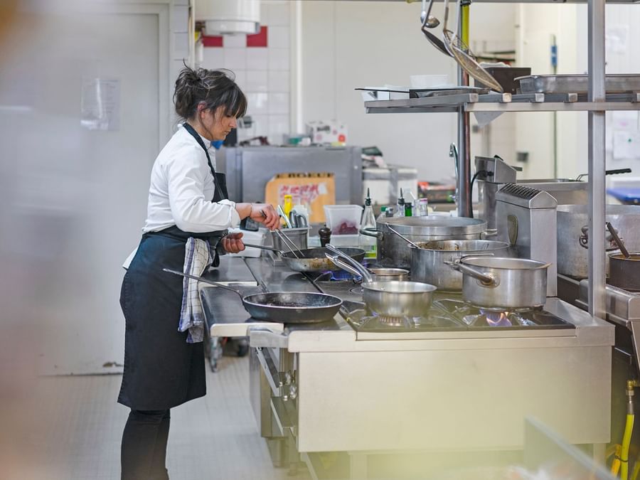 A chef prepares food at hotel le pillebois