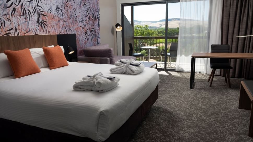 Interior of Comfy bedroom with a balcony at Novotel Barossa